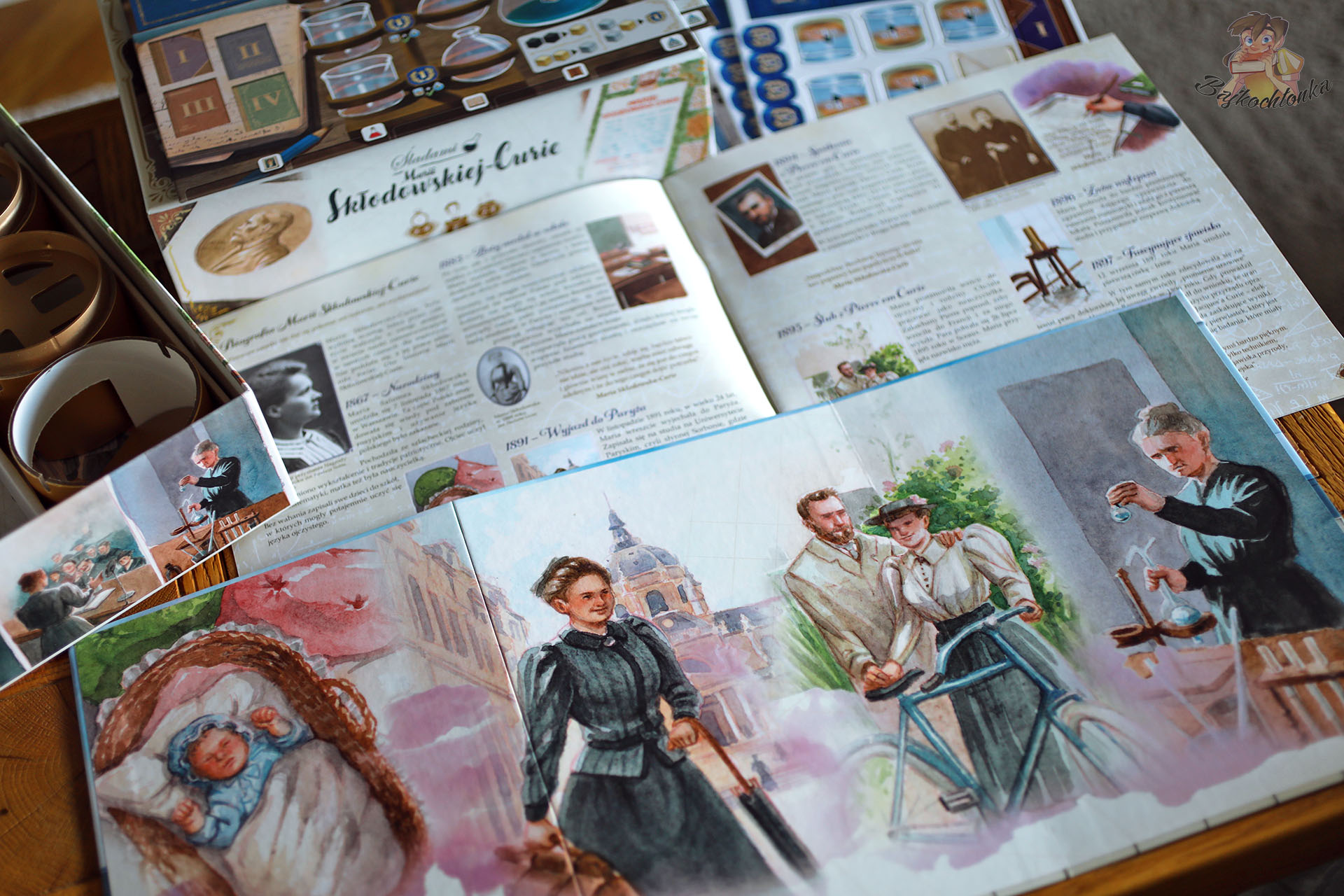 Plansza gracza i żeton Marii Skłodowskiej-Curie w grze edukacyjnej Rebel