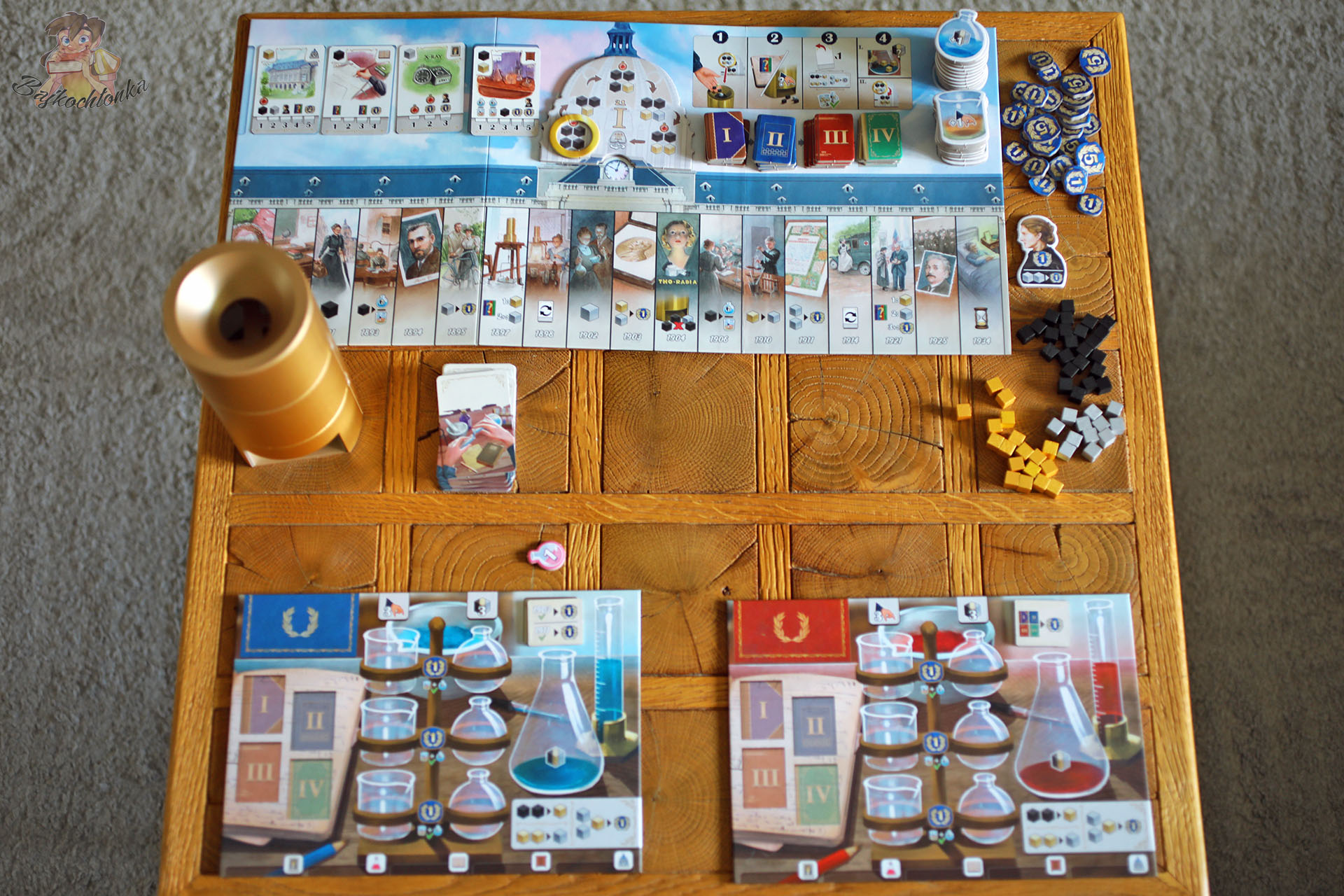 Ilustrowana biografia Marii Skłodowskiej-Curie w grze planszowej Rebel