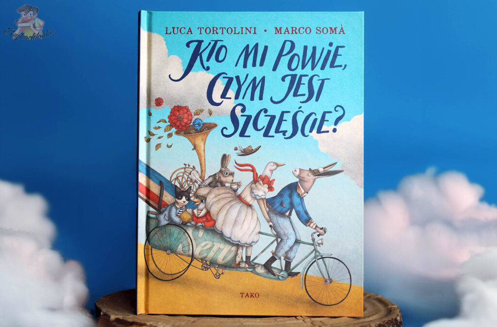 Okładka „Kto mi powie, czym jest szczęście?” – picturebook/gift book Tortoliniego i Somy; poetycka podróż dla dzieci 4+ i dorosłych.