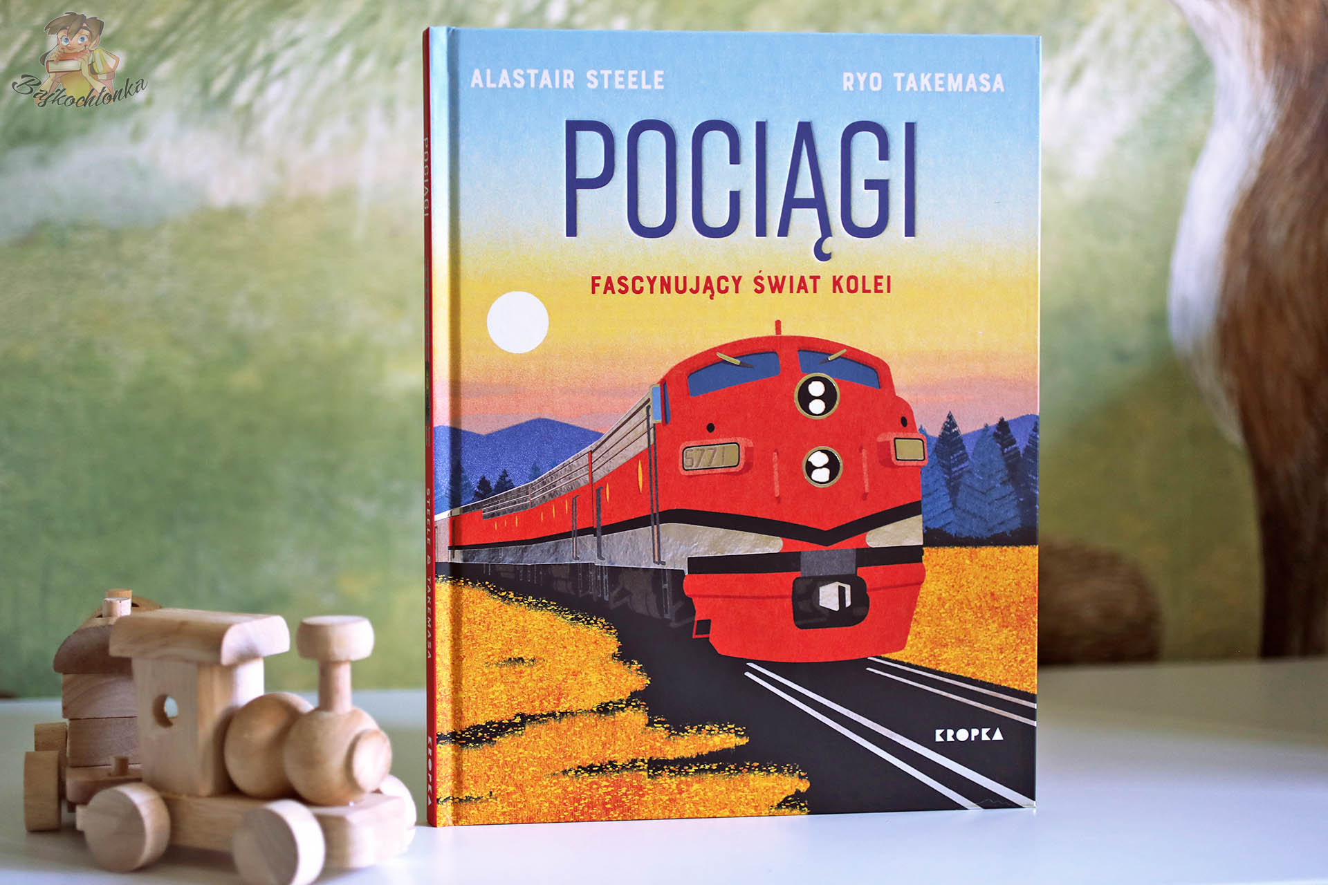 Okładka książki „Pociągi. Fascynujący świat kolei” Alastair Steele, ilustracje Ryo Takemasa