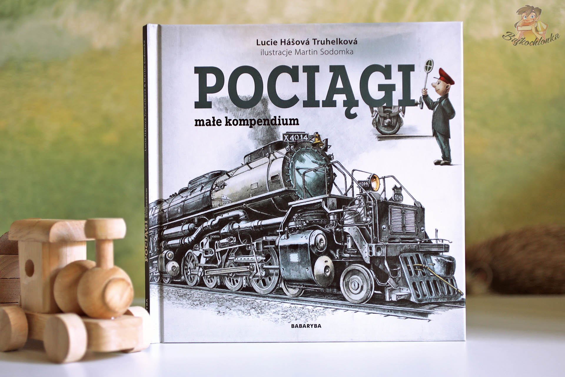 Lokomotywa parowa w książce „Pociągi. Małe kompendium” Babaryba