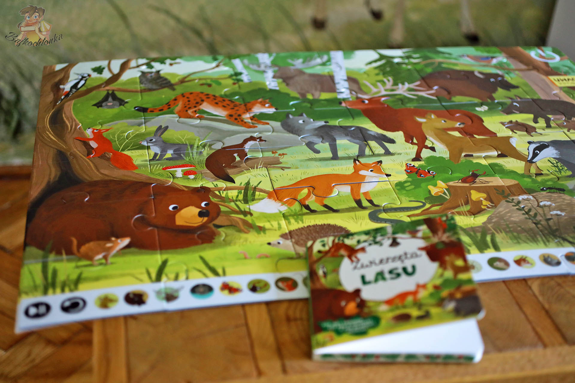 Ułożone puzzle „Zwierzęta lasu” z książeczką edukacyjną Kakadu.