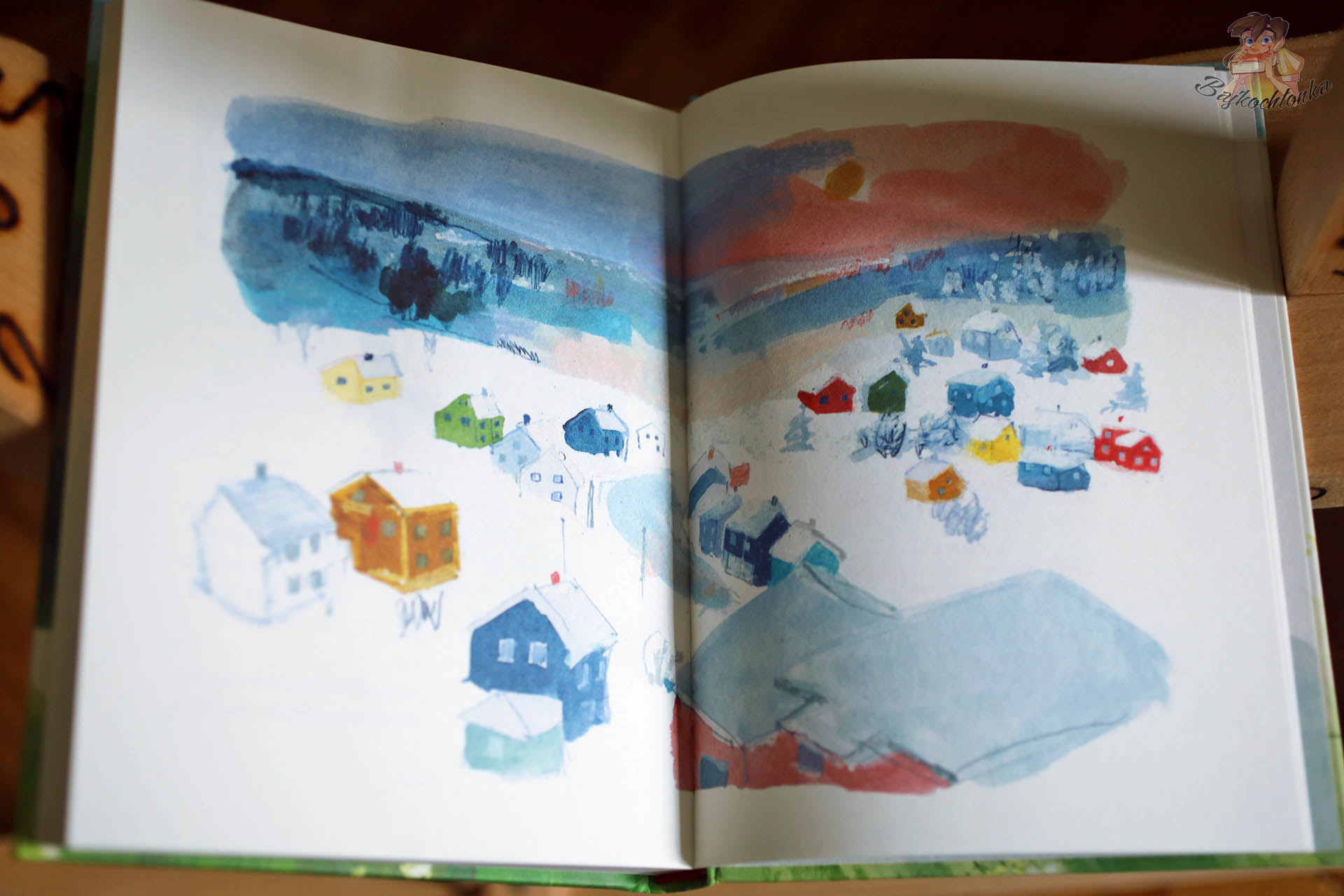 Oskar i ja. Wszystkie nasze miejsca – rozkladowka z akwarelowa panorama zimowej wsi (Dwie Siostry)