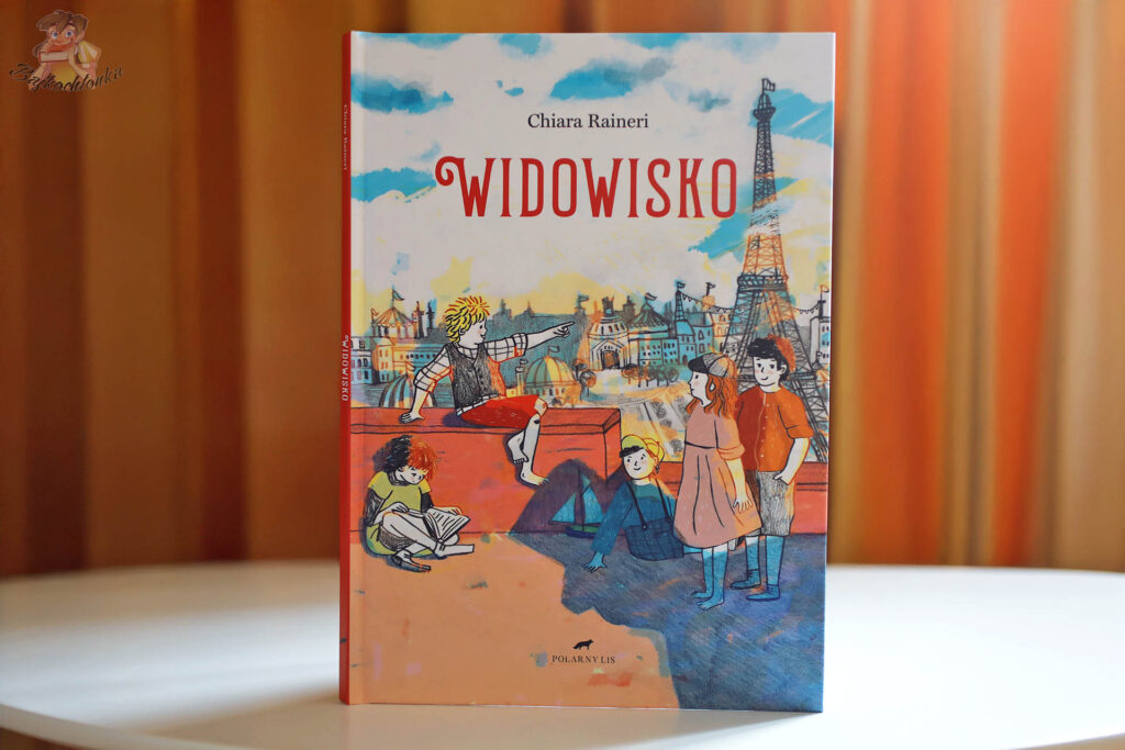 Widowisko – Chiara Raineri, okładka książki obrazkowej | Paryż i Wieża Eiffla w tle | wyd. Polarny Lis