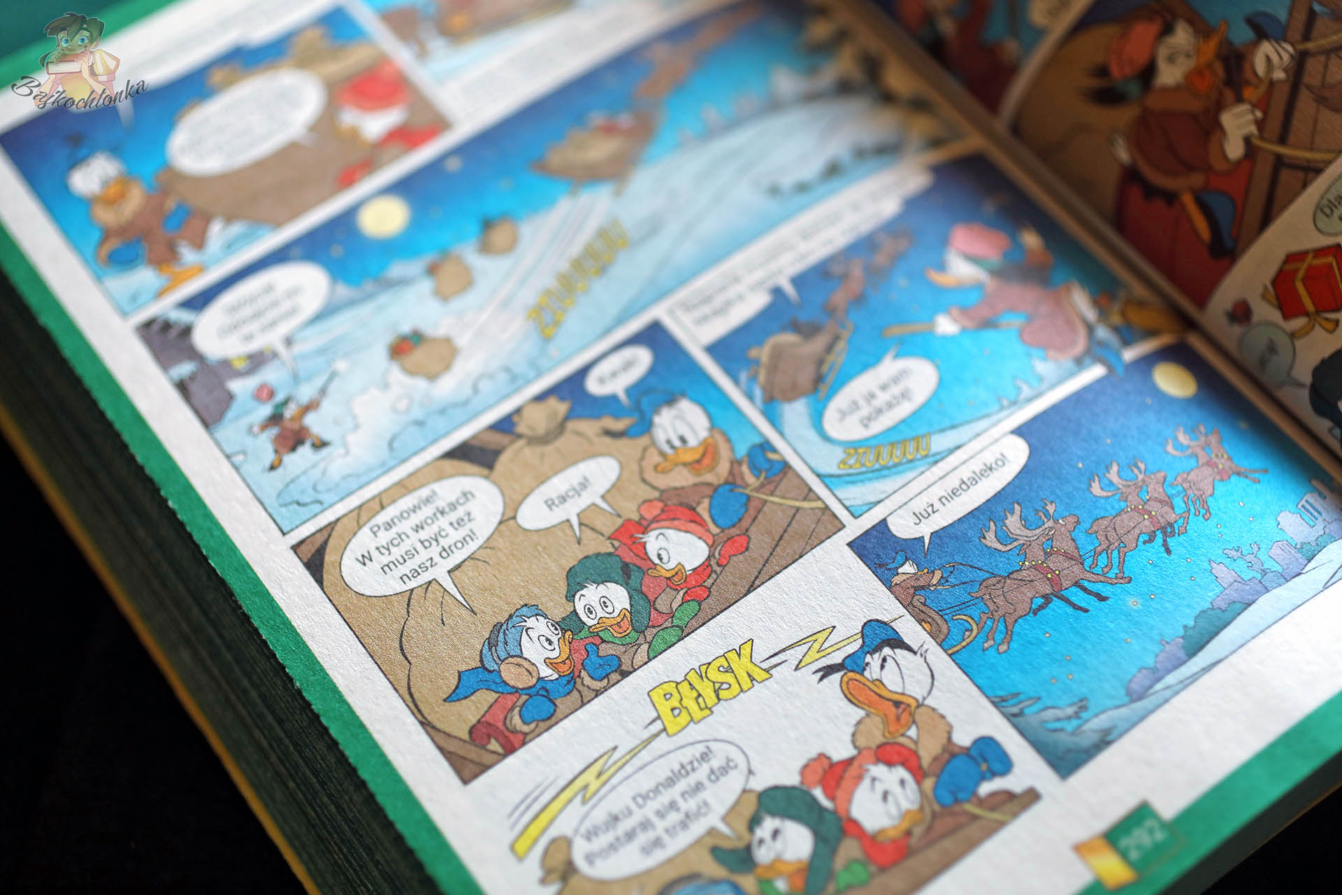 Strona z komiksu Mega Giga – świąteczna akcja z saniami i reniferami