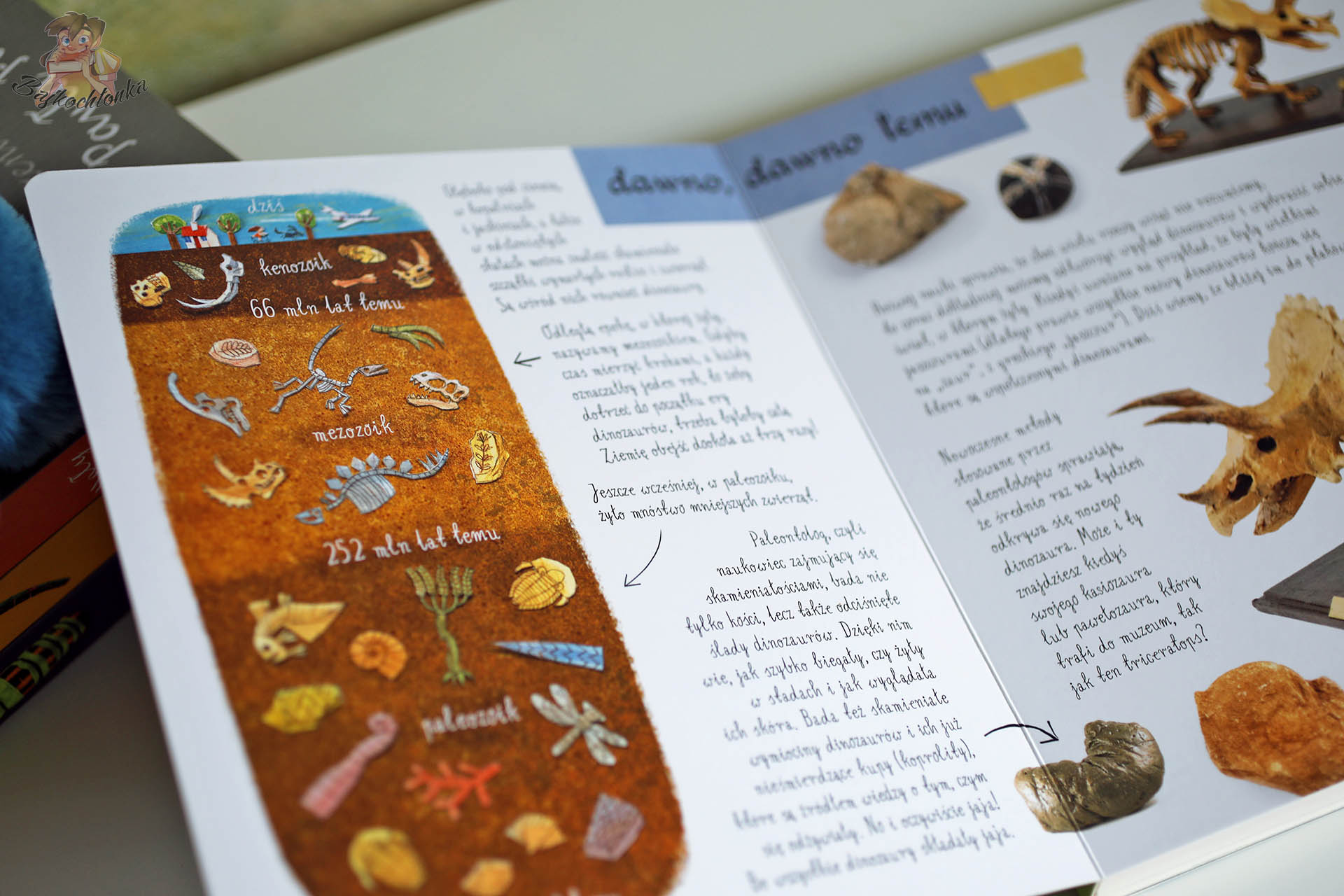 Strona z epokami geologicznymi w książce Mały atlas dinozaurów – paleozoik, mezozoik i skamieniałości