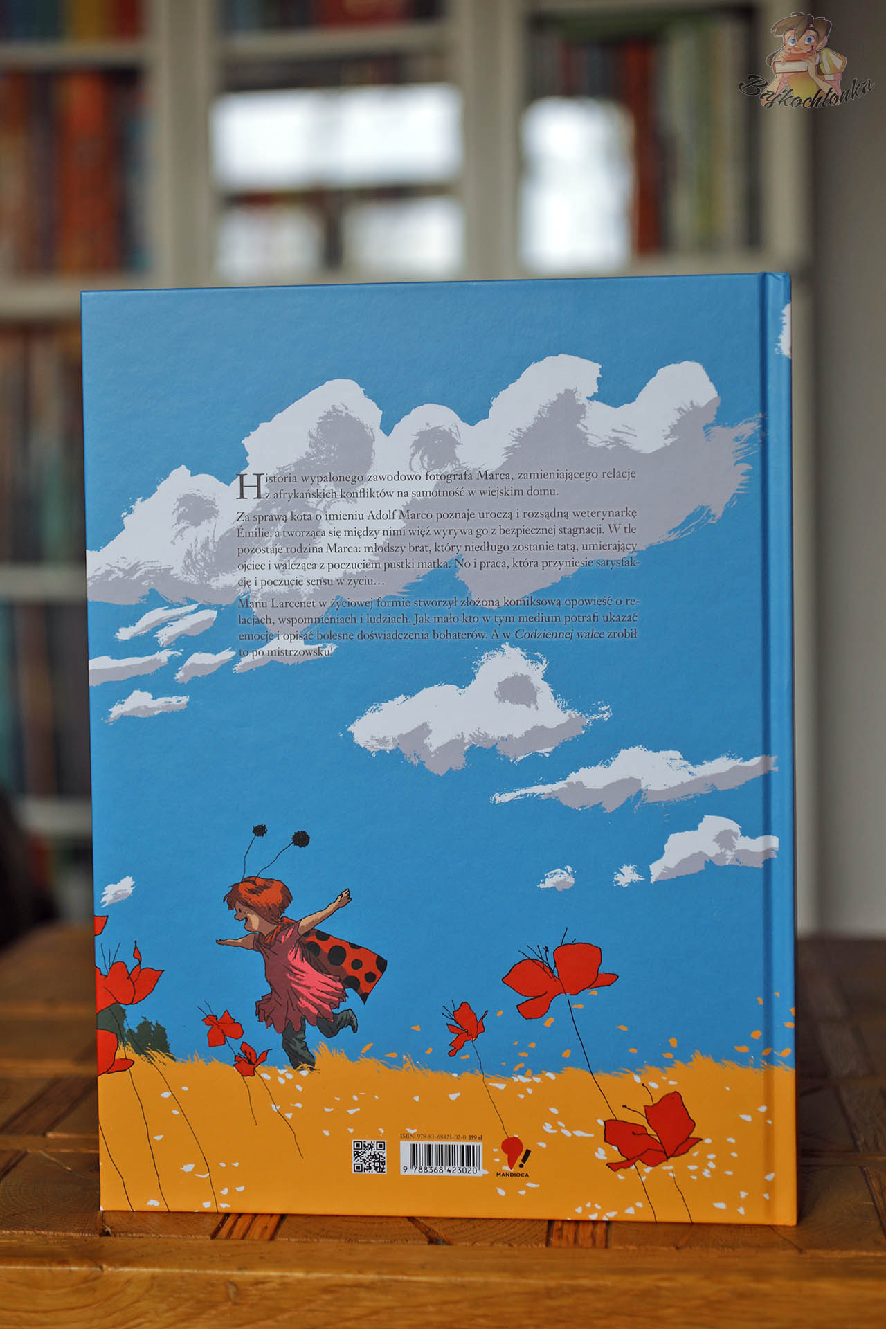 Tylna okładka komiksu Codzienna walka Manu Larceneta z opisem fabuły i ilustracją pola maków