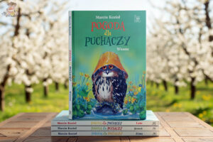 Okładka książki Pogoda dla puchaczy. Wiosna Marcina Kozioła na tle kwitnących drzew