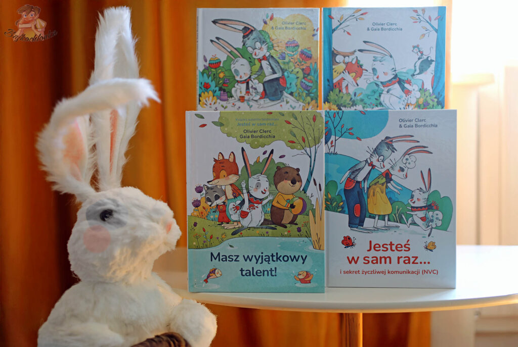 Książki z serii o Pomponie autorstwa Oliviera Clerca i Gai Bordicchii z pluszowym królikiem obok